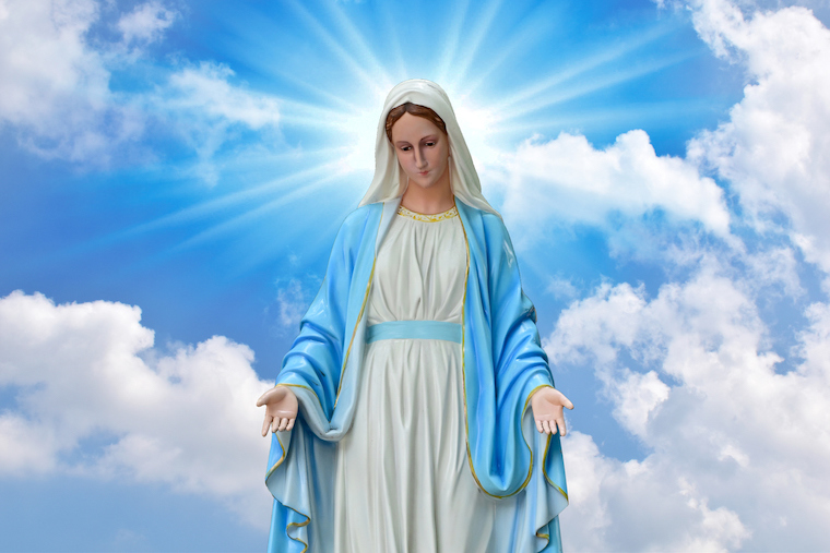 Statue of Our lady of grace virgin Mary with Bright Blue Sky and beautiful clouds with abstract colored background